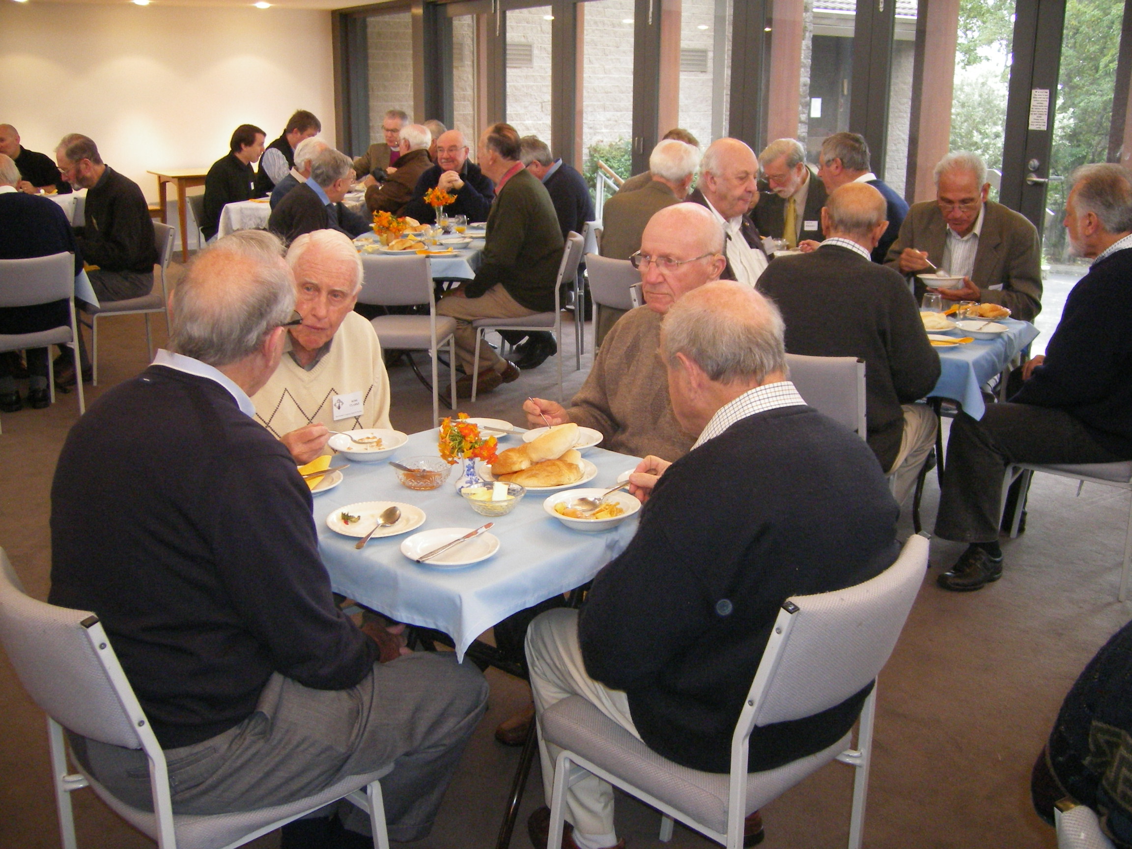 Some of the men of the parish enjoy breakfast together